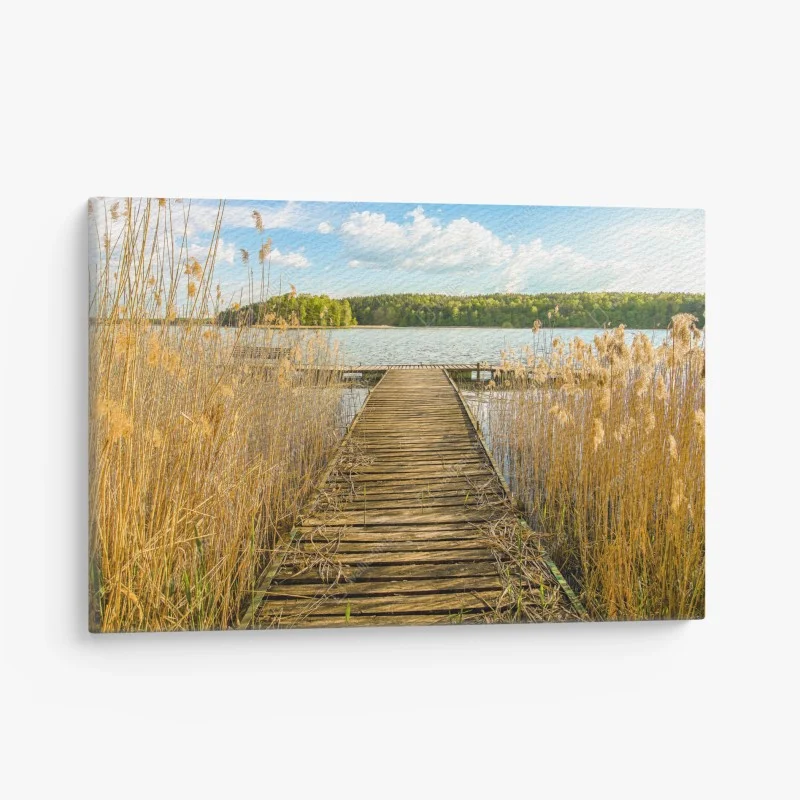 Canvas print wooden pier leading to a tranquil lake