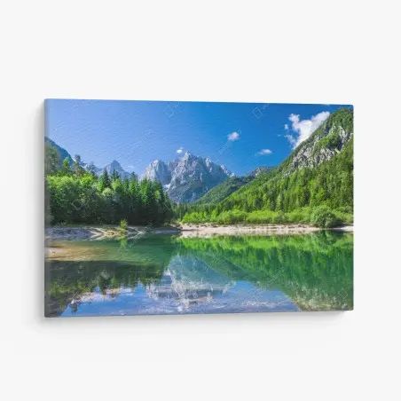 Canvas print alpine lake reflection in green mountains • Wallissimo®