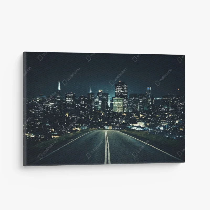 Canvas print road to illuminated city skyline at night