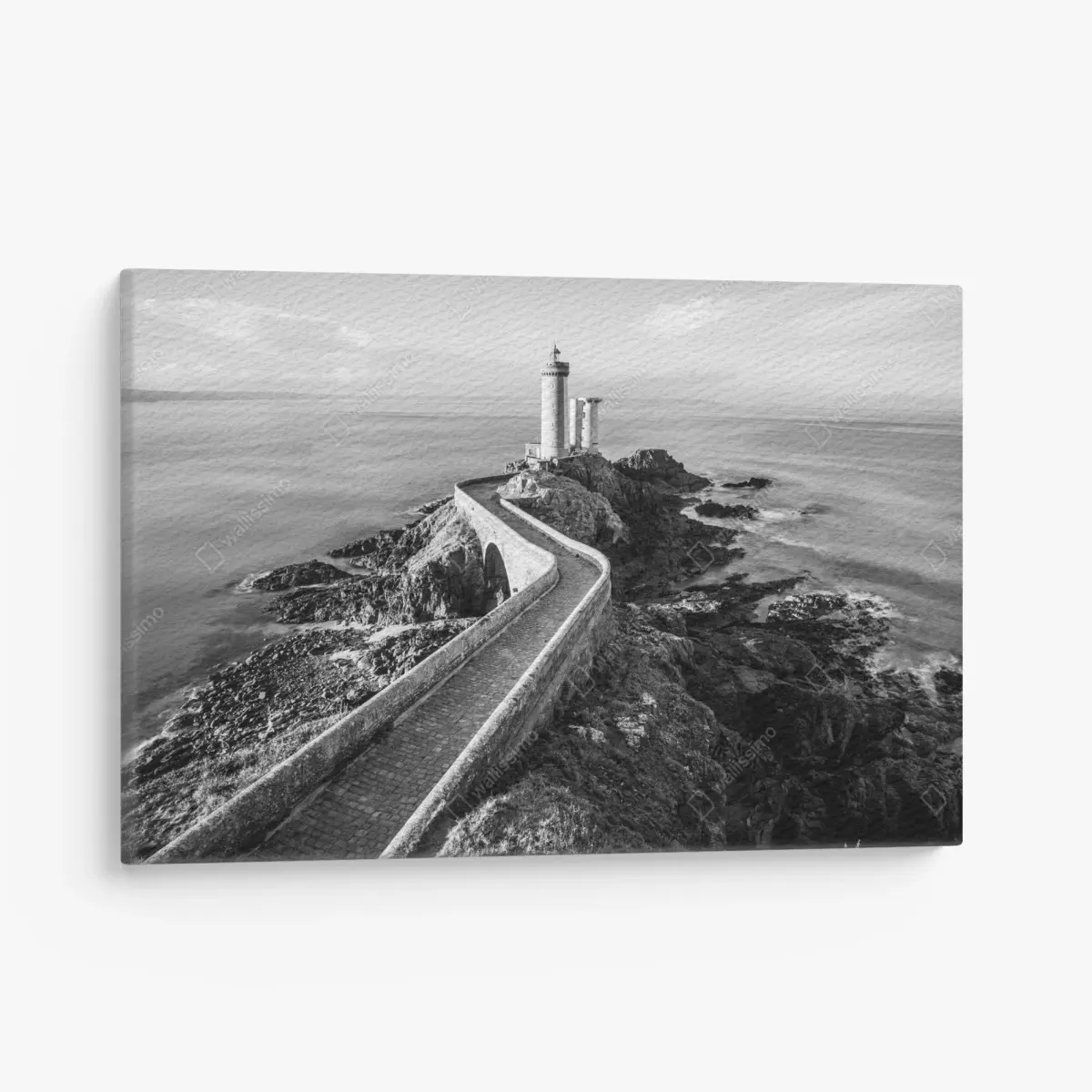 Canvas print lighthouse on rocky coast pathway • Wallissimo®
