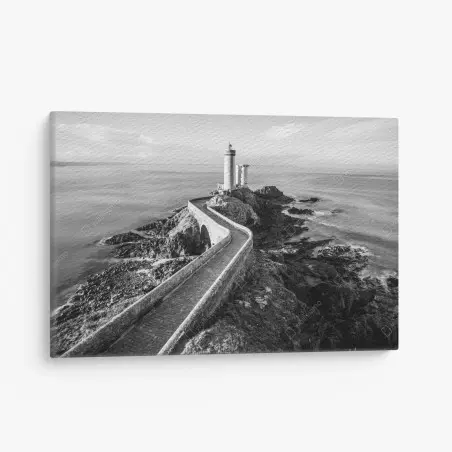 Canvas print lighthouse on rocky coast pathway • Wallissimo®