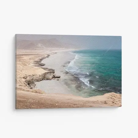 Canvas print serene turquoise coastline over desert cliffs • Wallissimo®