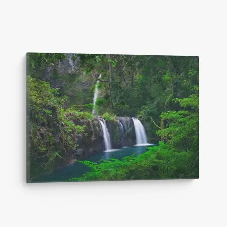 Canvas print calming waterfall in emerald forest • Wallissimo®