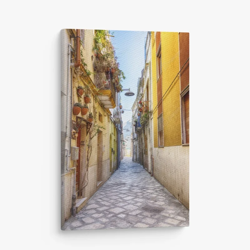 Canvas print sunlit alley in Brindisi