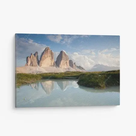 Canvas print sunlit alpine peaks reflected in a tranquil lake • Wallissimo®