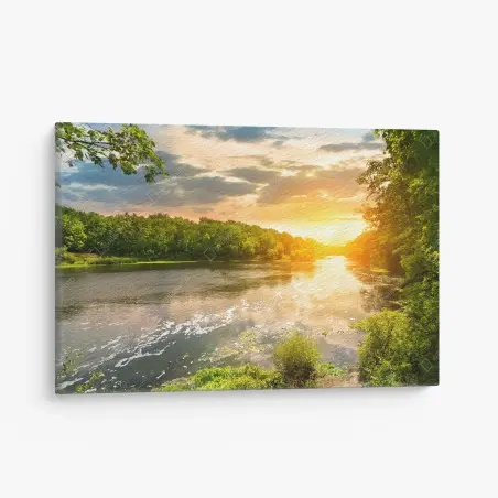 Canvas print serene riverside sunset over lush forest • Wallissimo®