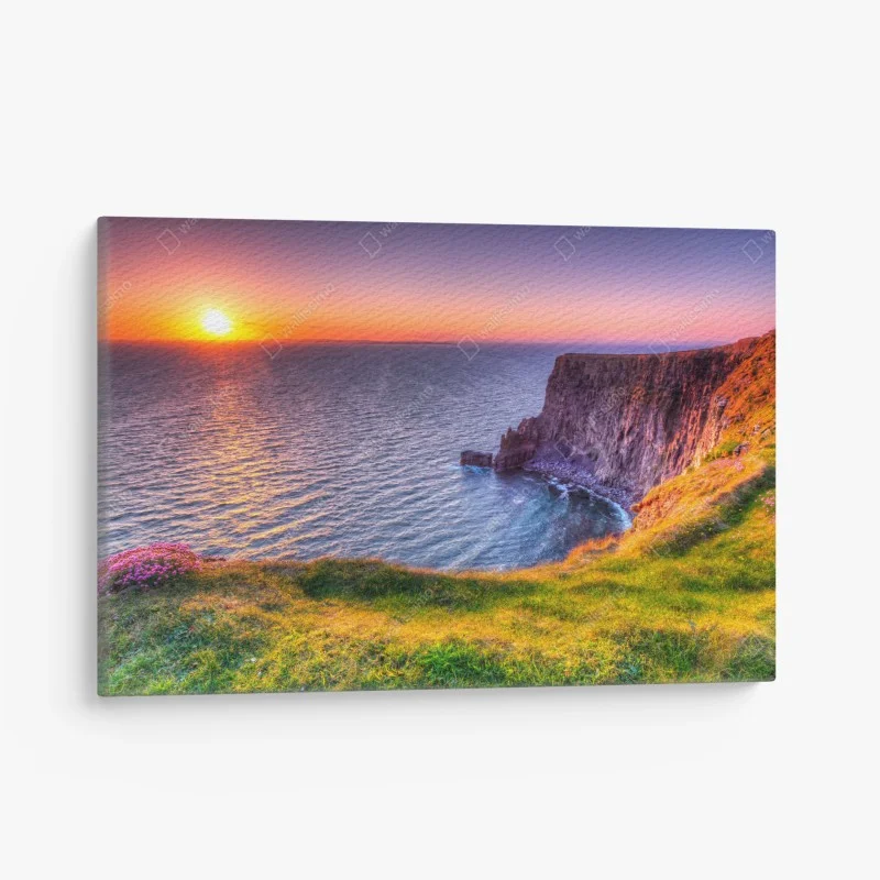 Canvas print sunset over rugged coastal cliffs