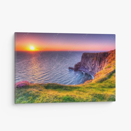Canvas print sunset over rugged coastal cliffs • Wallissimo®