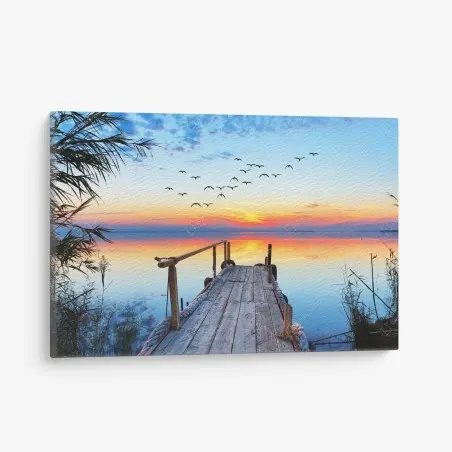 Canvas print sunset pier over tranquil lake • Wallissimo®
