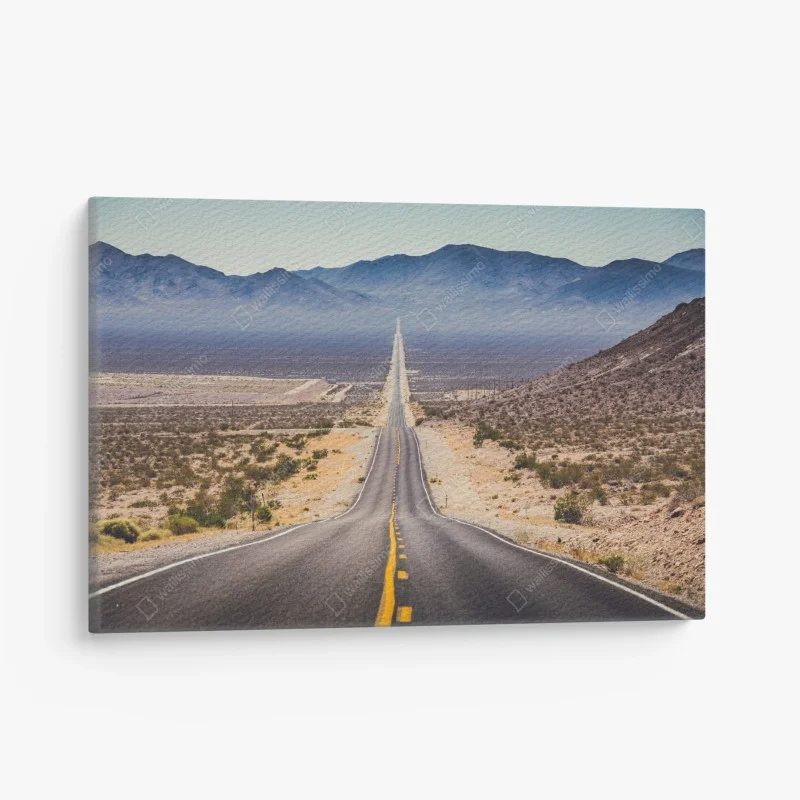 Canvas print endless desert highway to the mountains