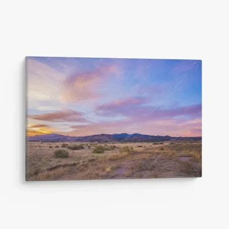 Canvas print pastel sunset over desert mountains • Wallissimo®