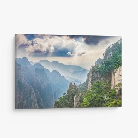 Canvas print misty mountain cliffs with sunrays • Wallissimo®