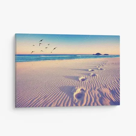 Canvas print magic footprints on a summer beach • Wallissimo®