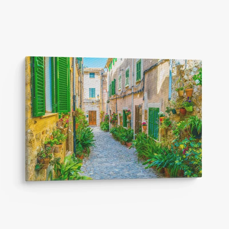 Canvas print sunlit alley with green shutters