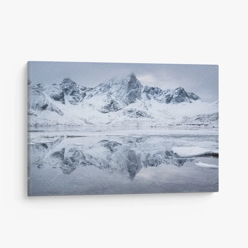 Canvas print snowy mountain ridge reflection in Norway