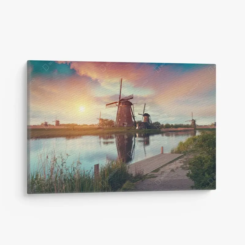 Canvas print sunset over windmills in the Netherlands
