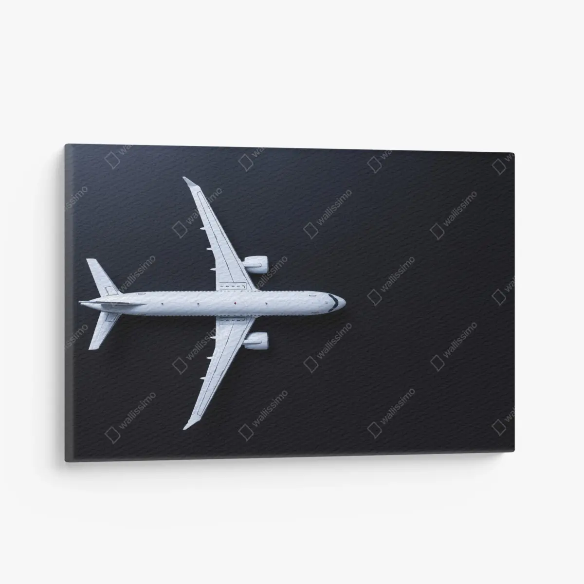 Canvas print white airplane top view on black background • Wallissimo®