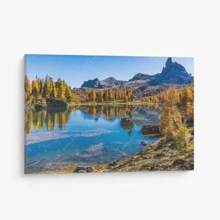 Canvas print autumn alpine lake with mountain reflections • Wallissimo®