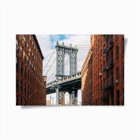 Poster Brooklyn bridge framed by brick buildings at sunset • Wallissimo®