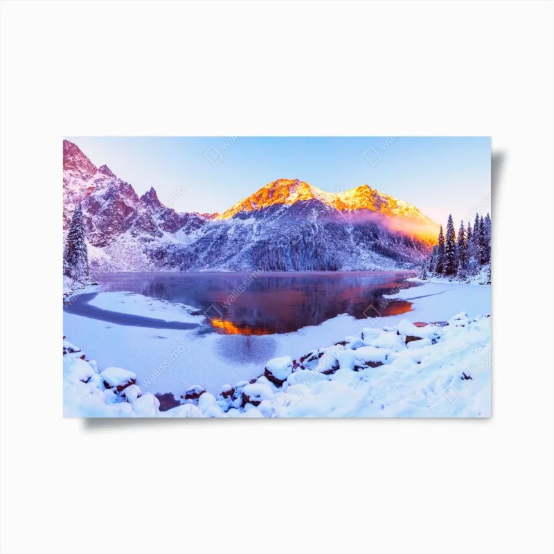 Poster sunlit mountains over frozen alpine lake