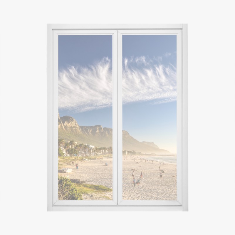 Window decal sunlit beach with mountain backdrop