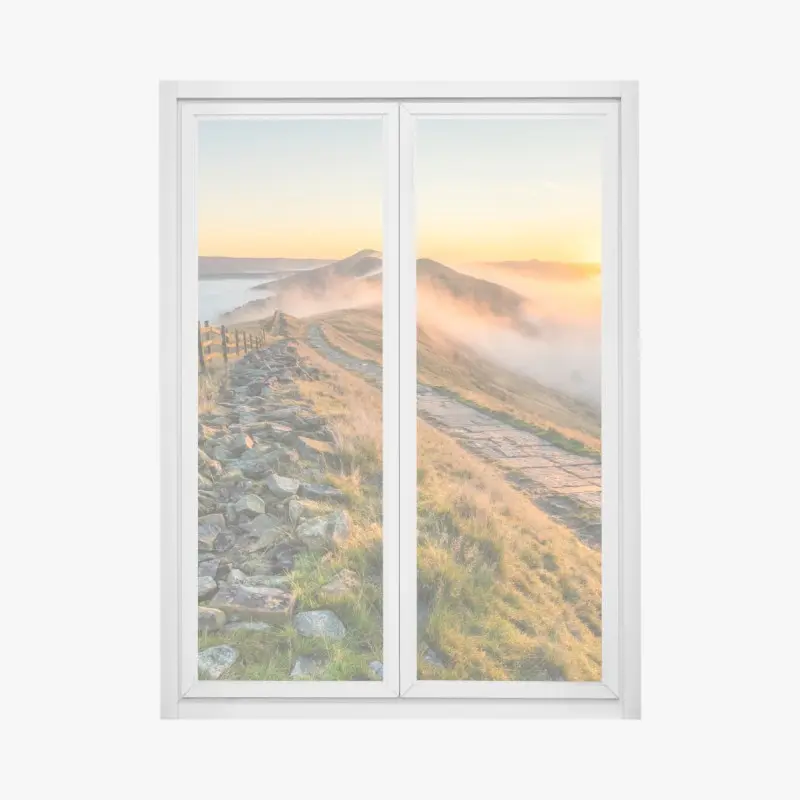 Window decal sunrise over a misty ridge with a stone path