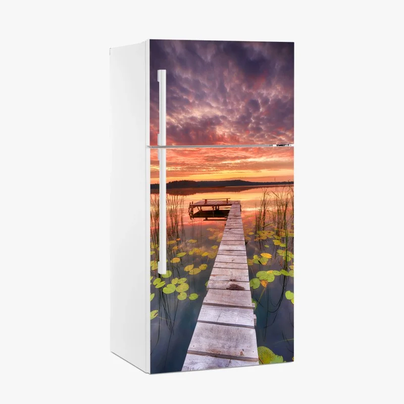 Fridge sticker sunrise over a tranquil lake pier
