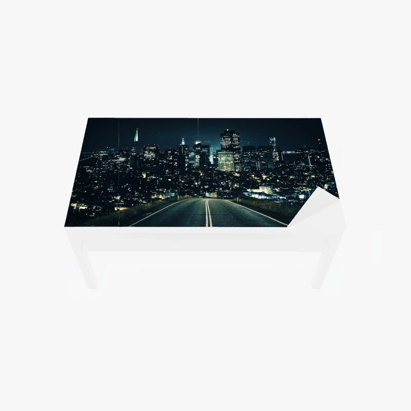 Table & desk veneer road to illuminated city skyline at night