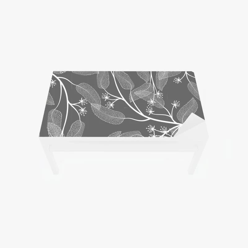 Table & desk veneer delicate white leaves on gray background