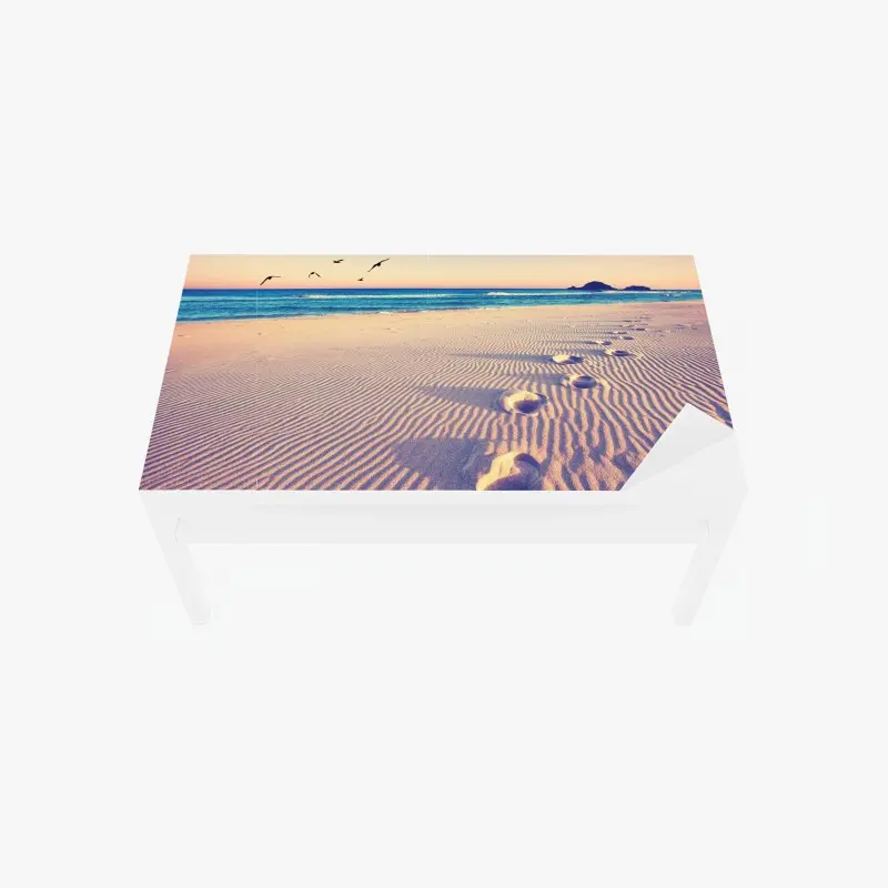 Table & desk veneer magic footprints on a summer beach