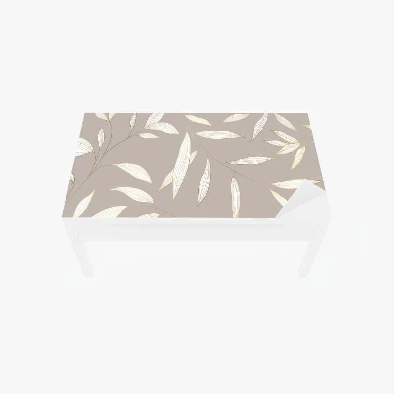 Table & desk veneer delicate gold-lined leaves on beige background