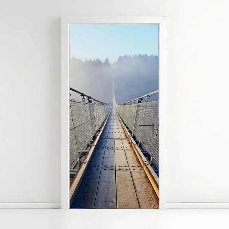Door sticker foggy suspension bridge leading into the woods