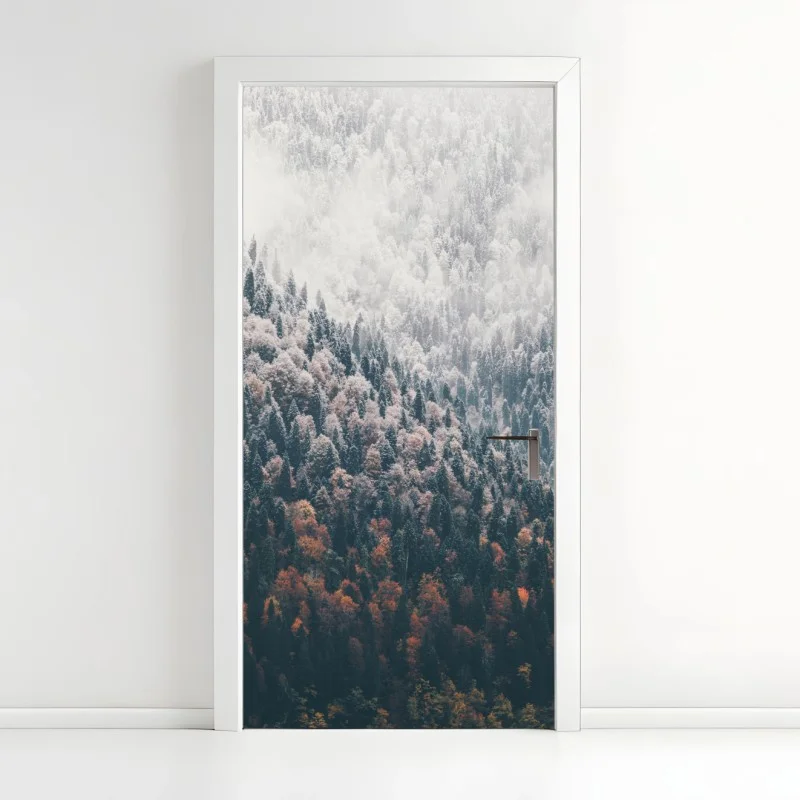 Door sticker misty autumn forest on snowy mountain