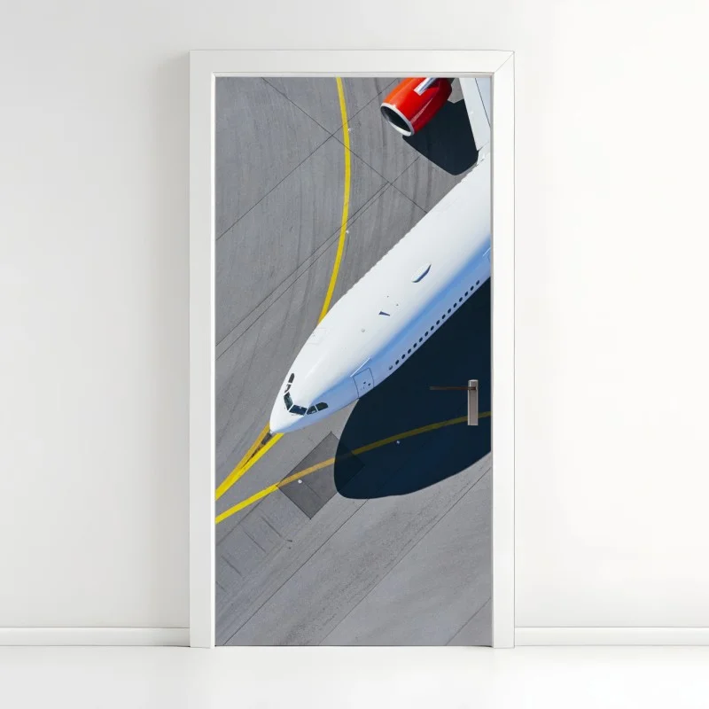 Door sticker aerial view of a white airplane on tarmac