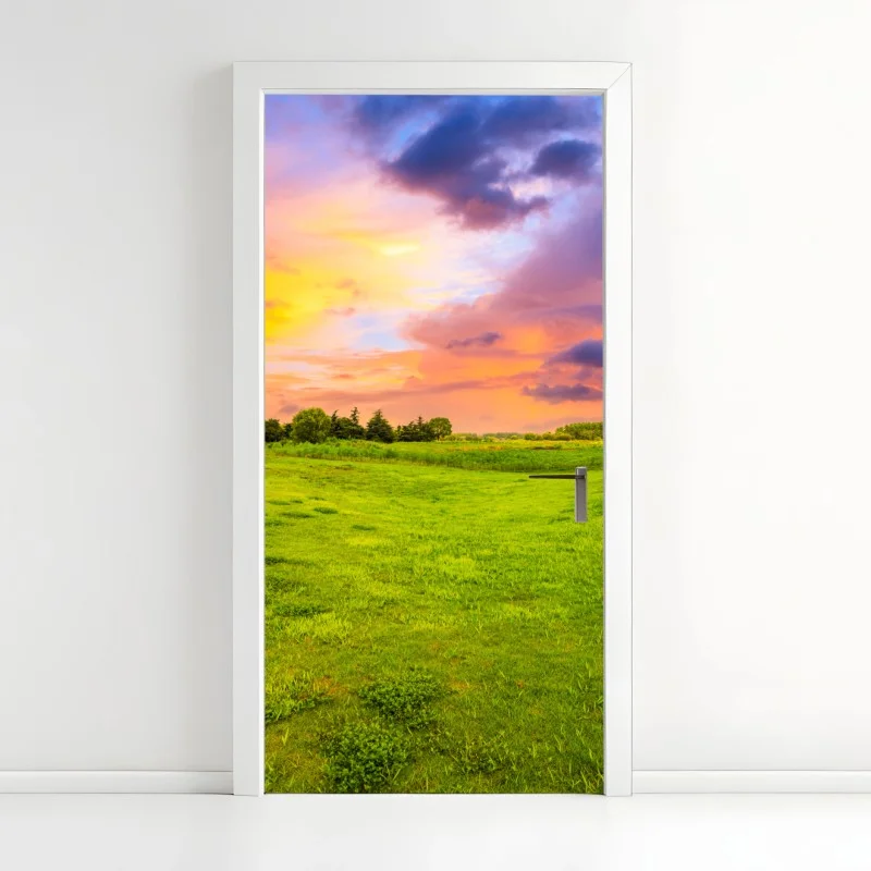 Door sticker sunset over green meadow