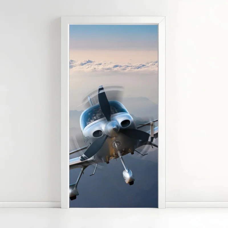Door sticker silver propeller plane over misty mountains