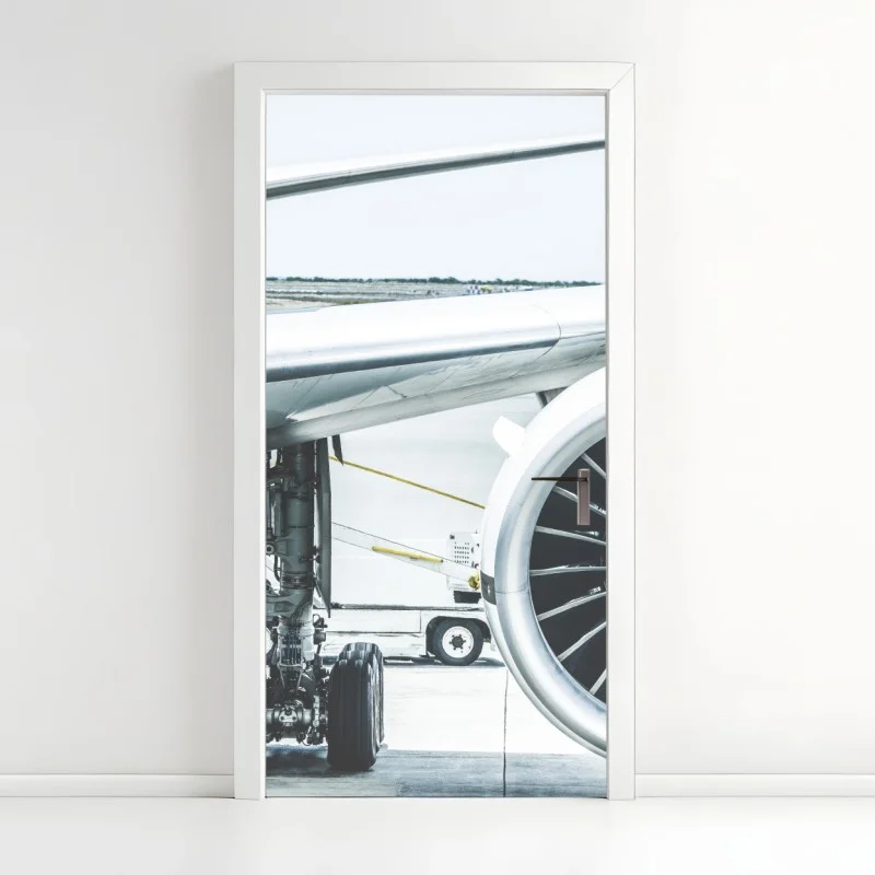 Door sticker close-up of jet engine at terminal