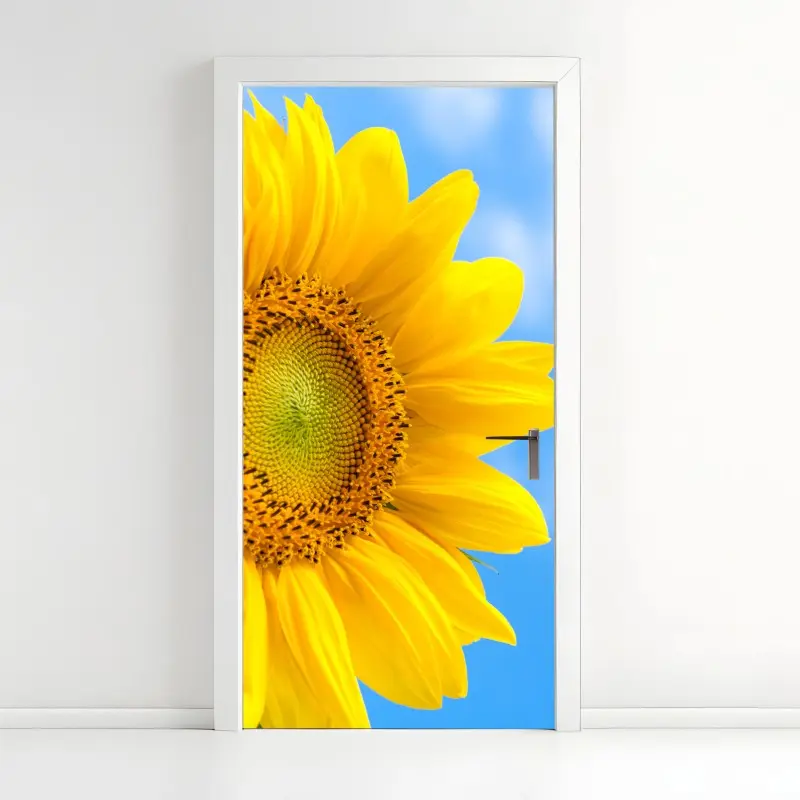 Door sticker bright sunflower close-up on blue sky