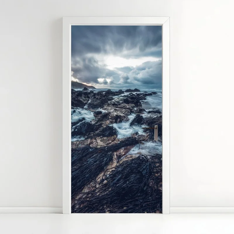 Door sticker moody rocky coastline at dusk