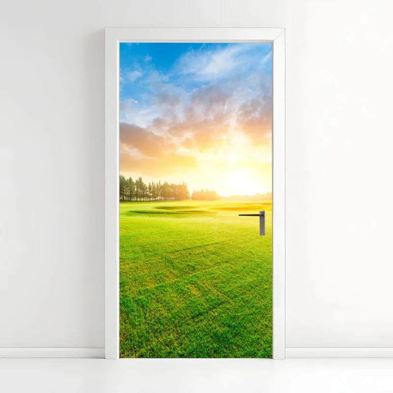 Door sticker sunlit meadow and forest at sunrise