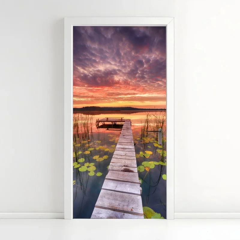 Door sticker sunrise over a tranquil lake pier