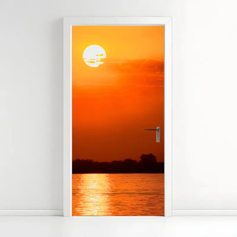 Door sticker golden sunset over tranquil lake