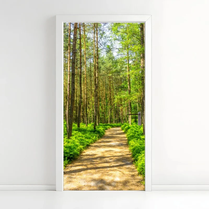 Door sticker sunlit forest path through green pines