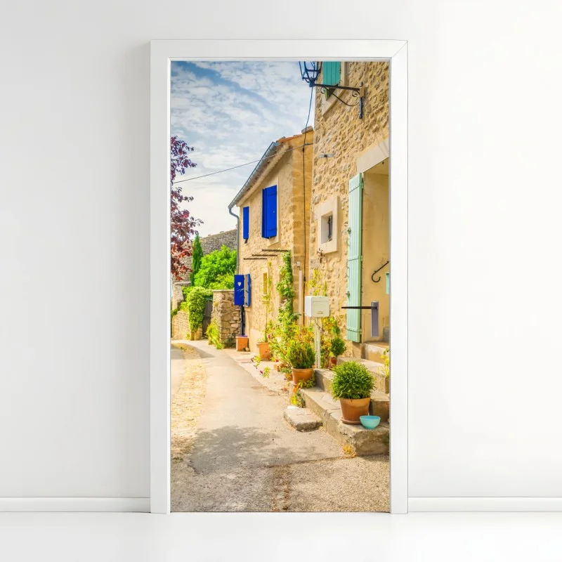 Door sticker sunlit stone village street with colorful shutters