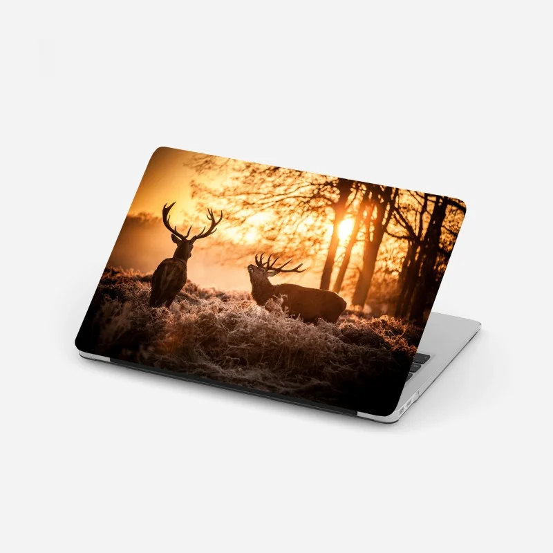 Laptop sticker golden sunrise stags in a frosty meadow