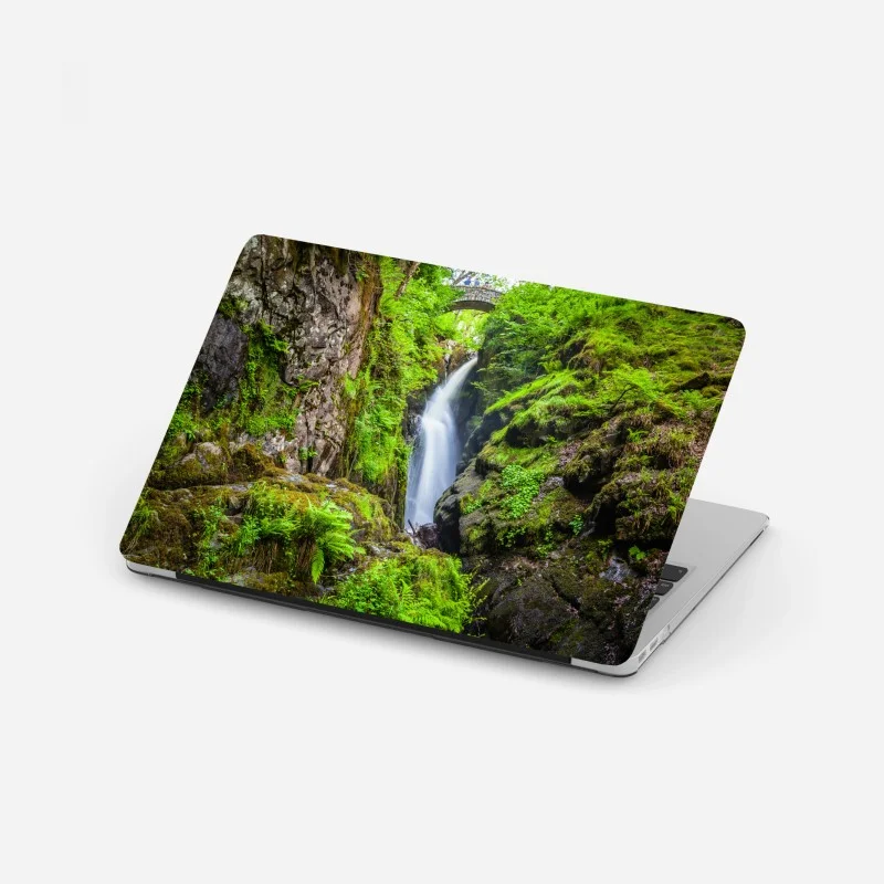 Laptop sticker mossy gorge waterfall with stone bridge