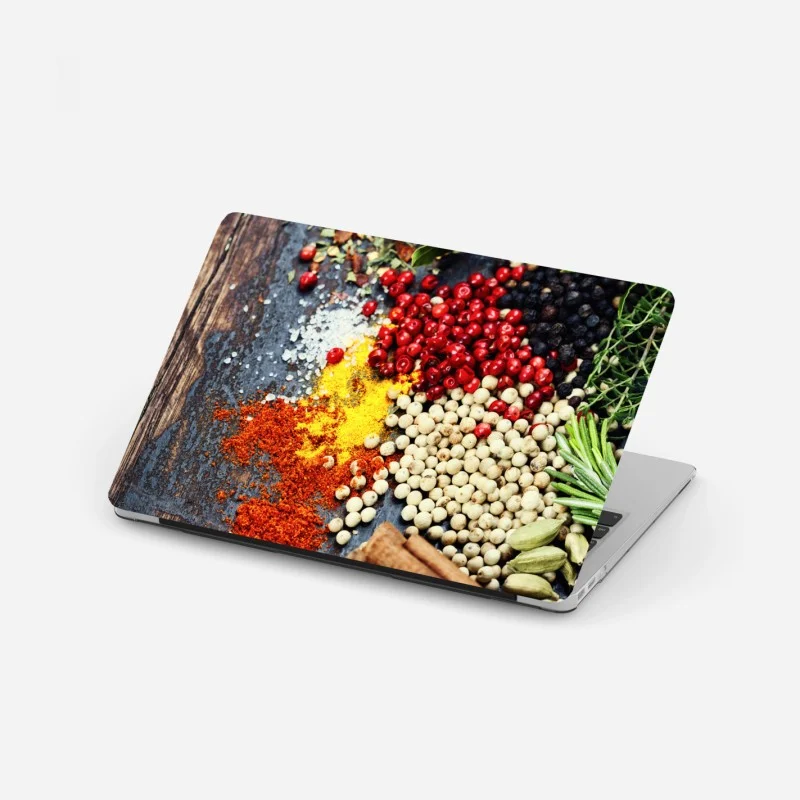 Laptop sticker vibrant spice assortment on rustic wood