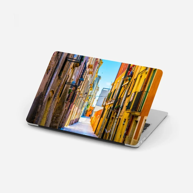 Laptop sticker sunlit Mediterranean street with colorful facades