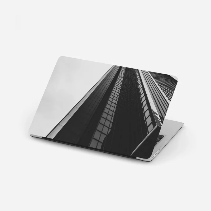Laptop sticker towering modern skyscraper in monochrome