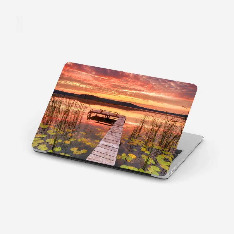 Laptop sticker sunrise over a tranquil lake pier